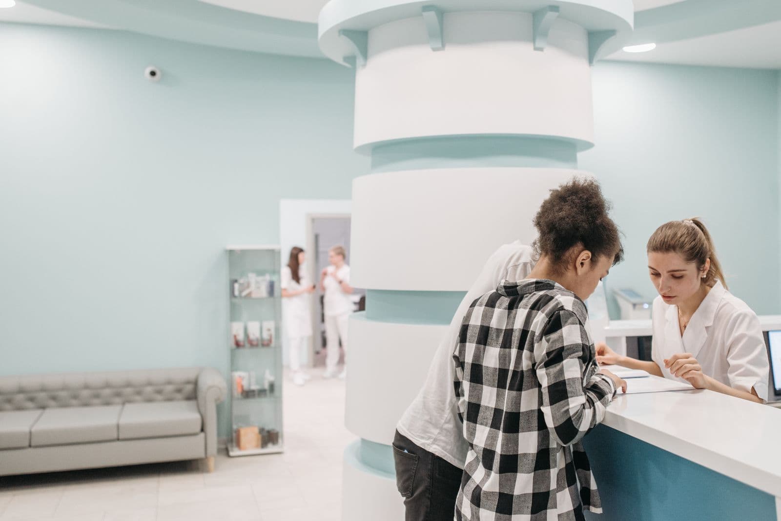 Documents being reviewed at a healthcare reception desk